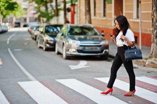 woman walking on zebra crossing